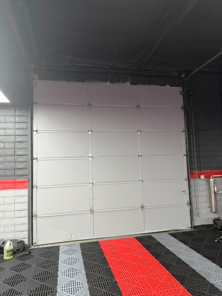 White raised panel garage door installed at Van Nuys residential property by MSB Garage Door Repair