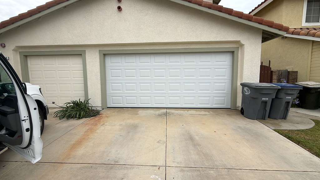 Roll-up commercial style garage door with chain hoist installed at Marina del Rey property