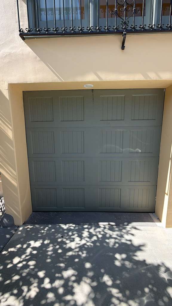 Close-up of worn extension springs on Van Nuys residential garage door needing replacement